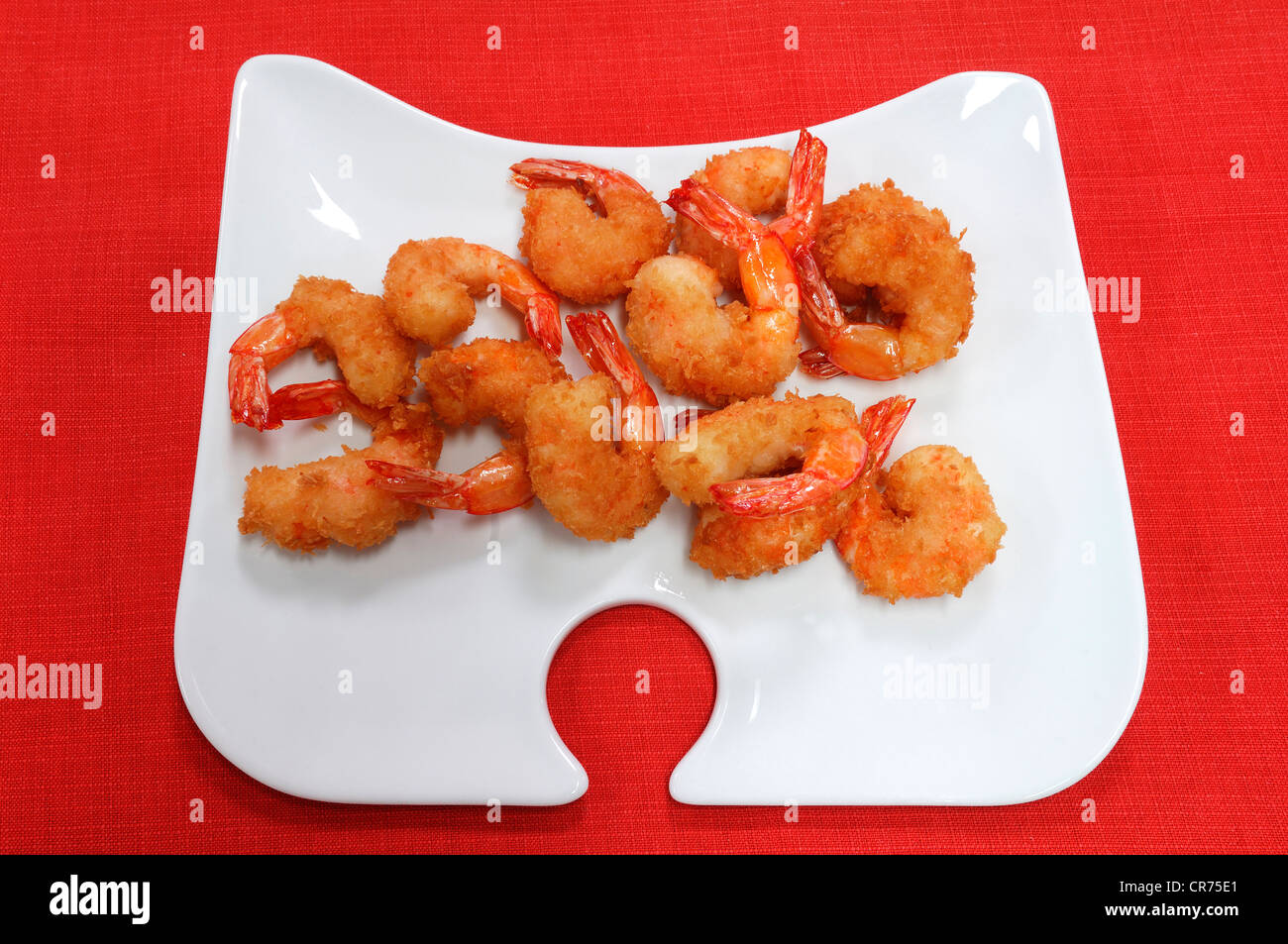 Deep-fried shrimps (Caridina cf. cantonensis var. Crystal Red), served on a white plate Stock Photo