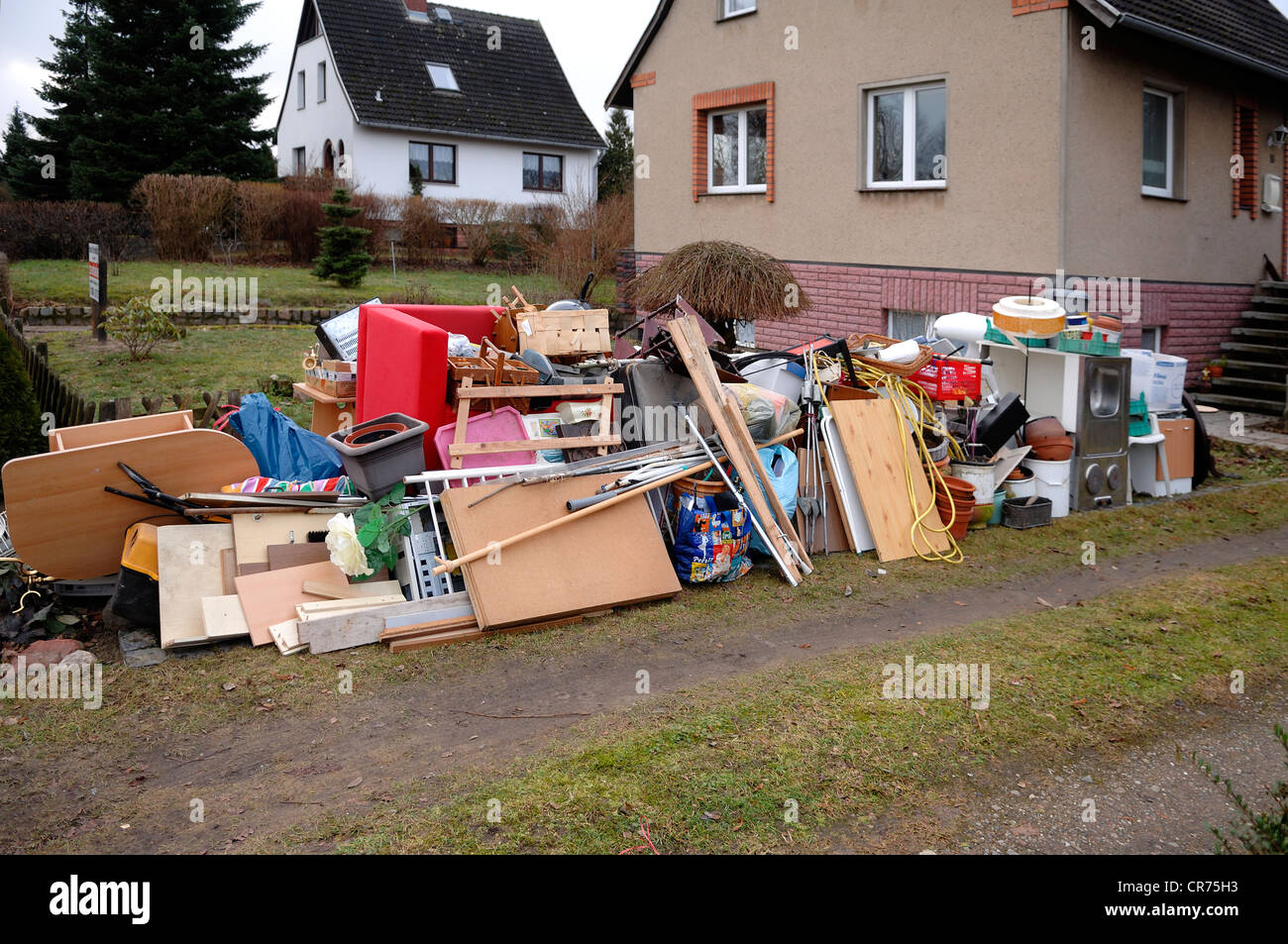 Bulky waste in front of an emptied house, Boerzow, Mecklenburg-Western Pomerania, Germany, Europe Stock Photo