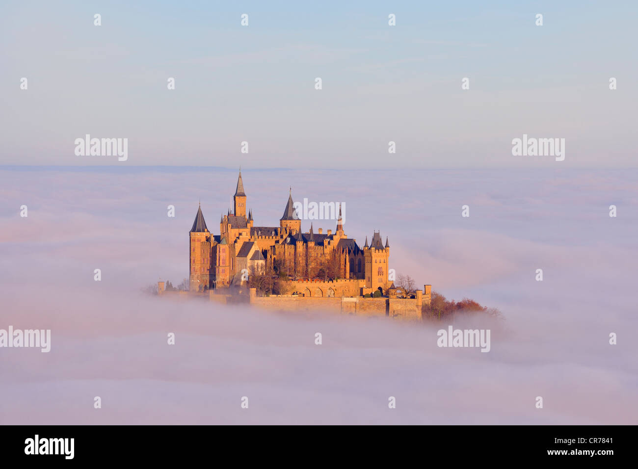 Burg Hohenzollern castle in morning light, early morning fog, Swabian Alb, Baden-Wuerttemberg, Germany, Europe Stock Photo