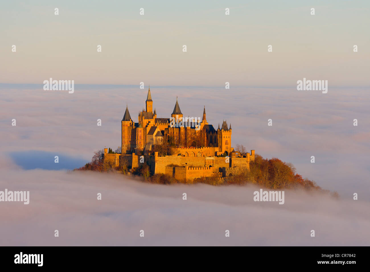 Burg Hohenzollern castle in morning light, early morning fog, Swabian Alb, Baden-Wuerttemberg, Germany, Europe Stock Photo