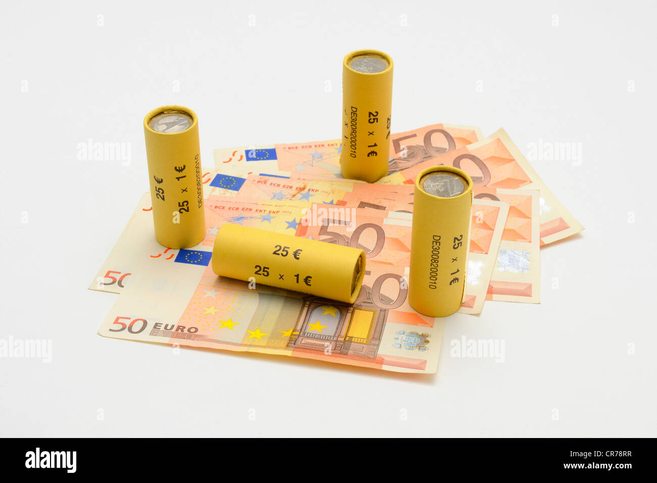 Rolls of one euro coins and euro banknotes Stock Photo