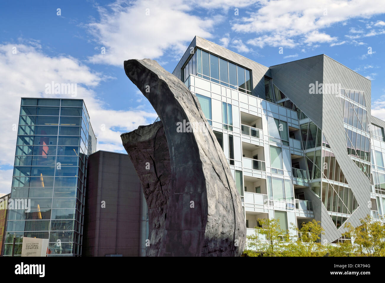 Modern facades of the Museum Residences, residential buildings in the Civic Center Cultural Complex, with a granite sculpture at Stock Photo