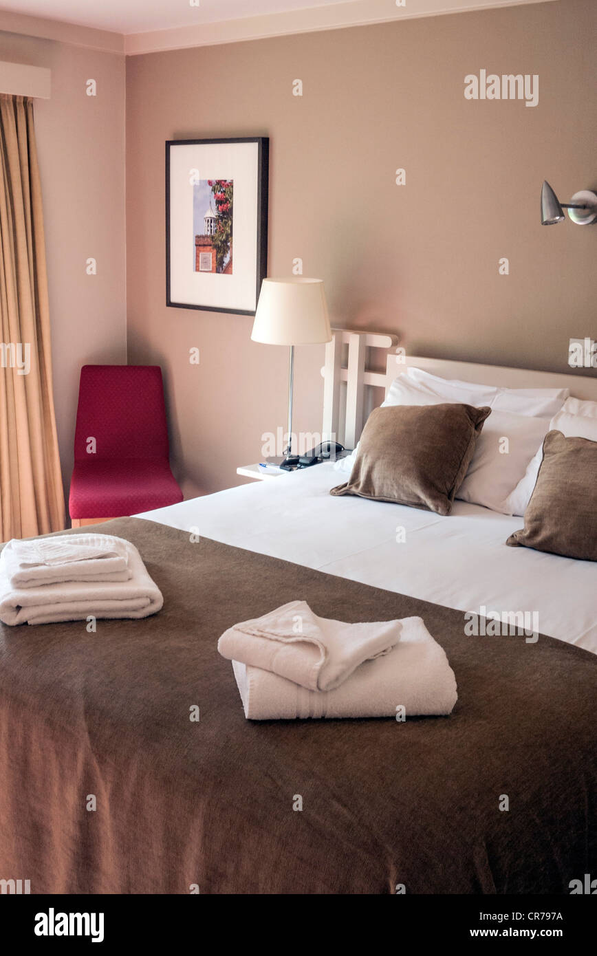 Hotel room with double bed ready for guests, England, UK Stock Photo