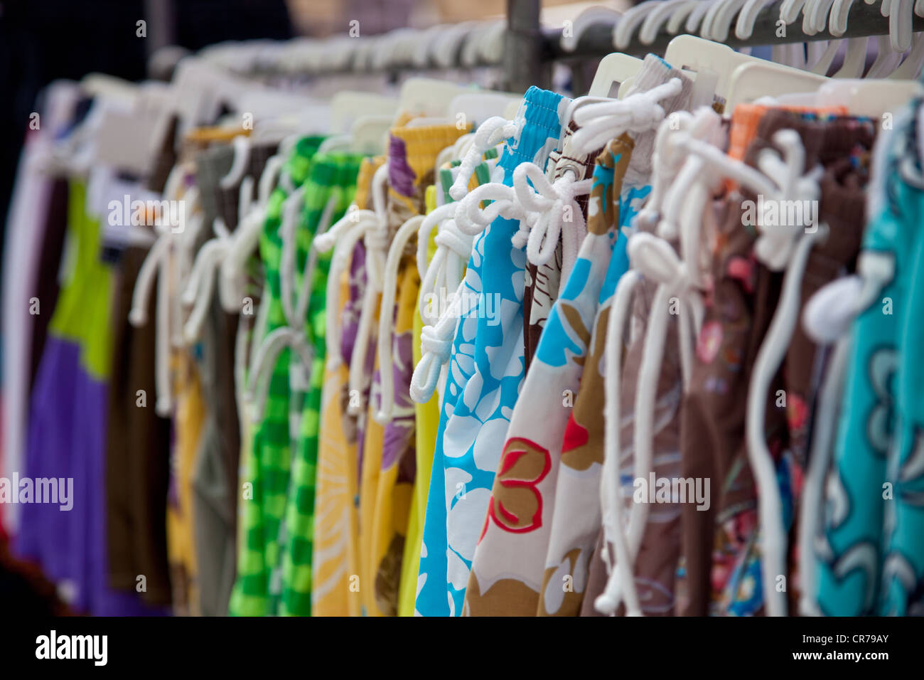 Market stall offering bathing suits. Stock Photo