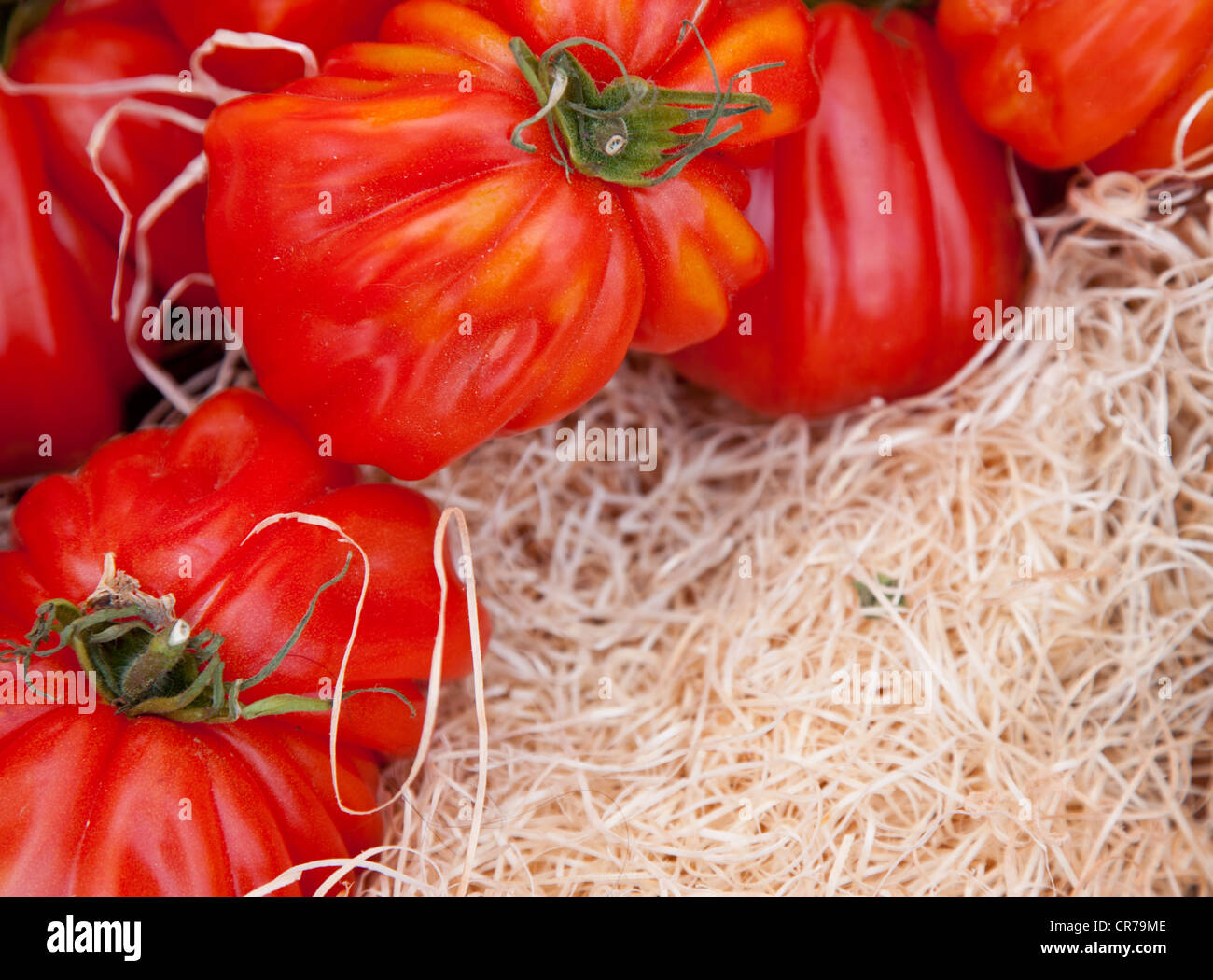 Fine ripe tomatos at market stall Stock Photo