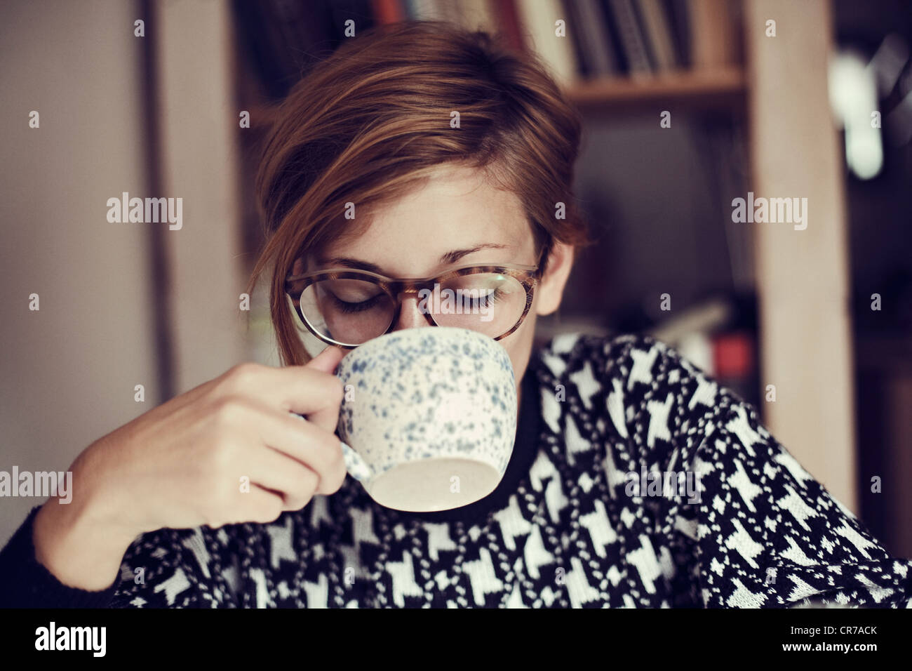 Germany, Young woman drinking, close up Stock Photo