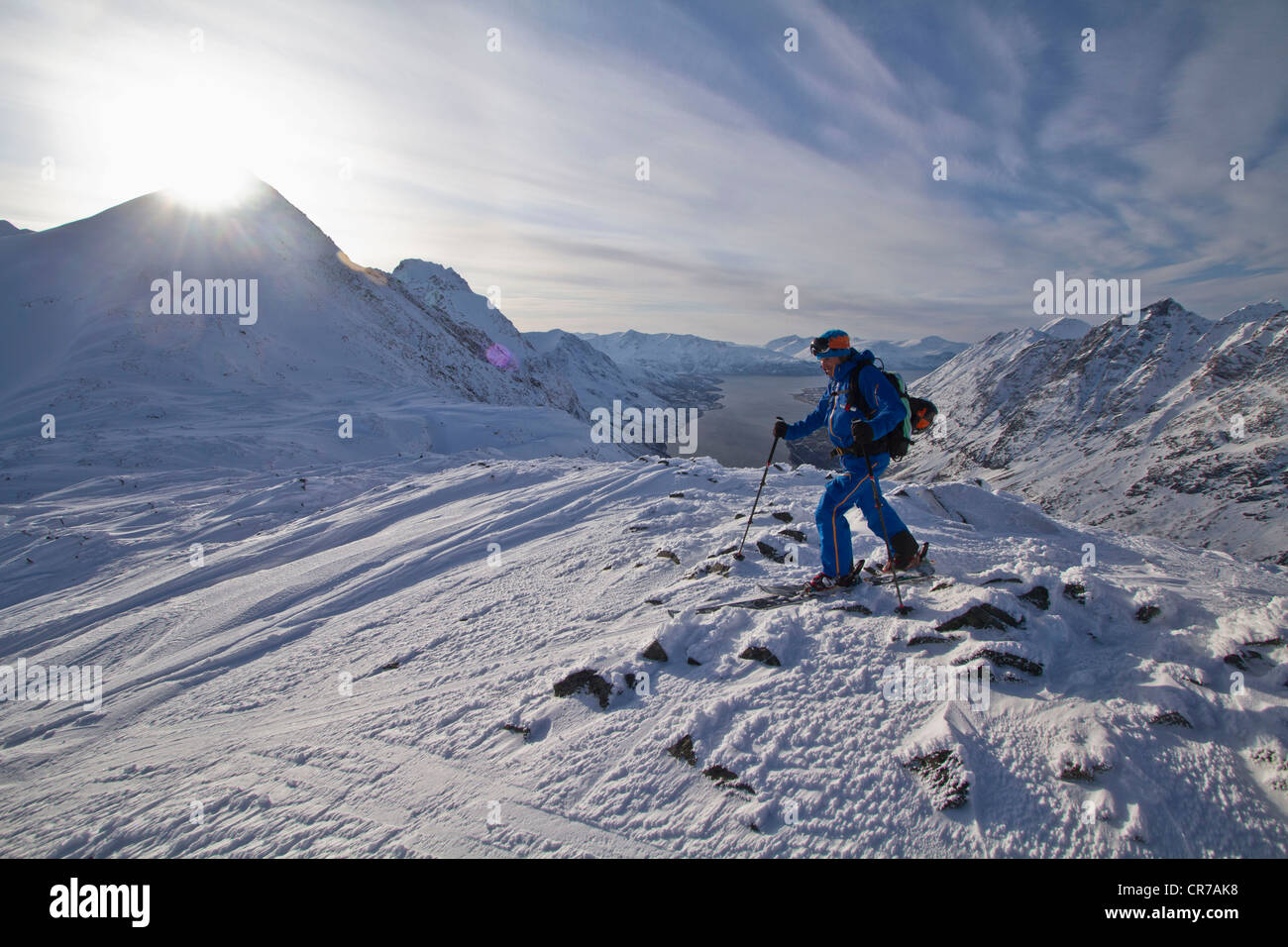 Norway, Skier walking in snow with pole Stock Photo