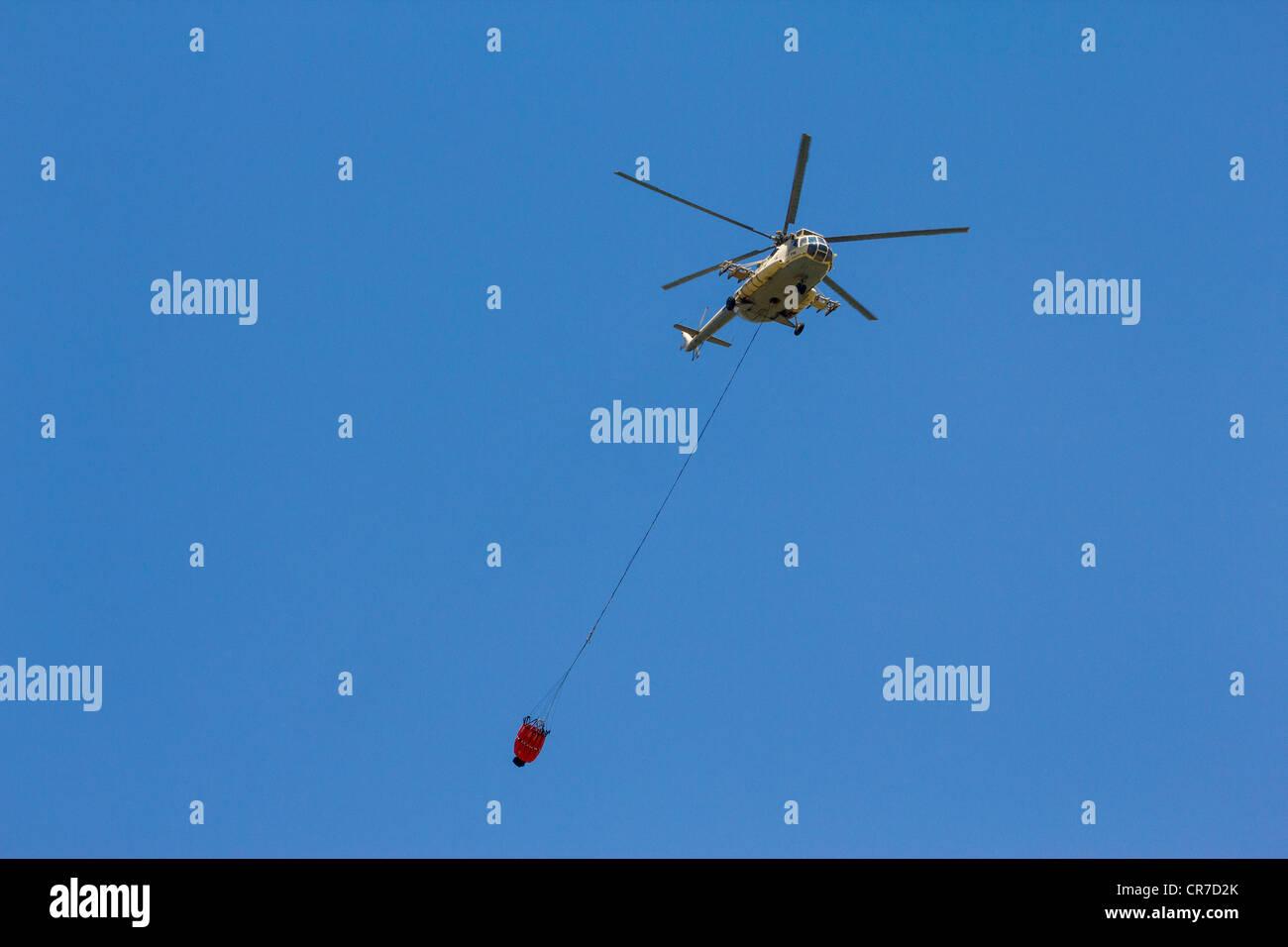 Egyptian military helicopter towing firefighting bucket Stock Photo