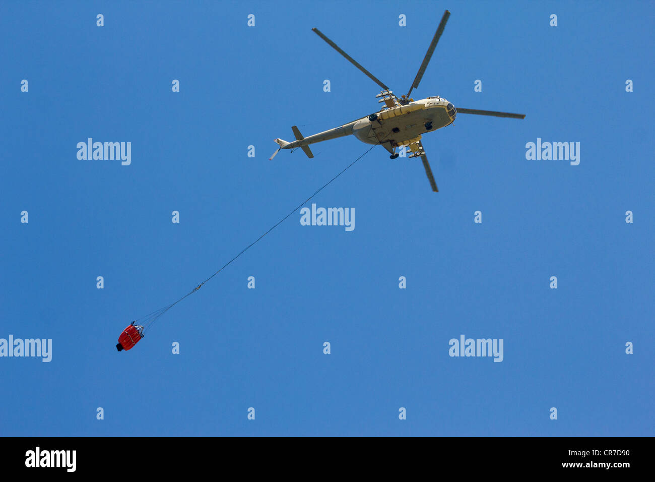 Egyptian military helicopter towing firefighting bucket Stock Photo