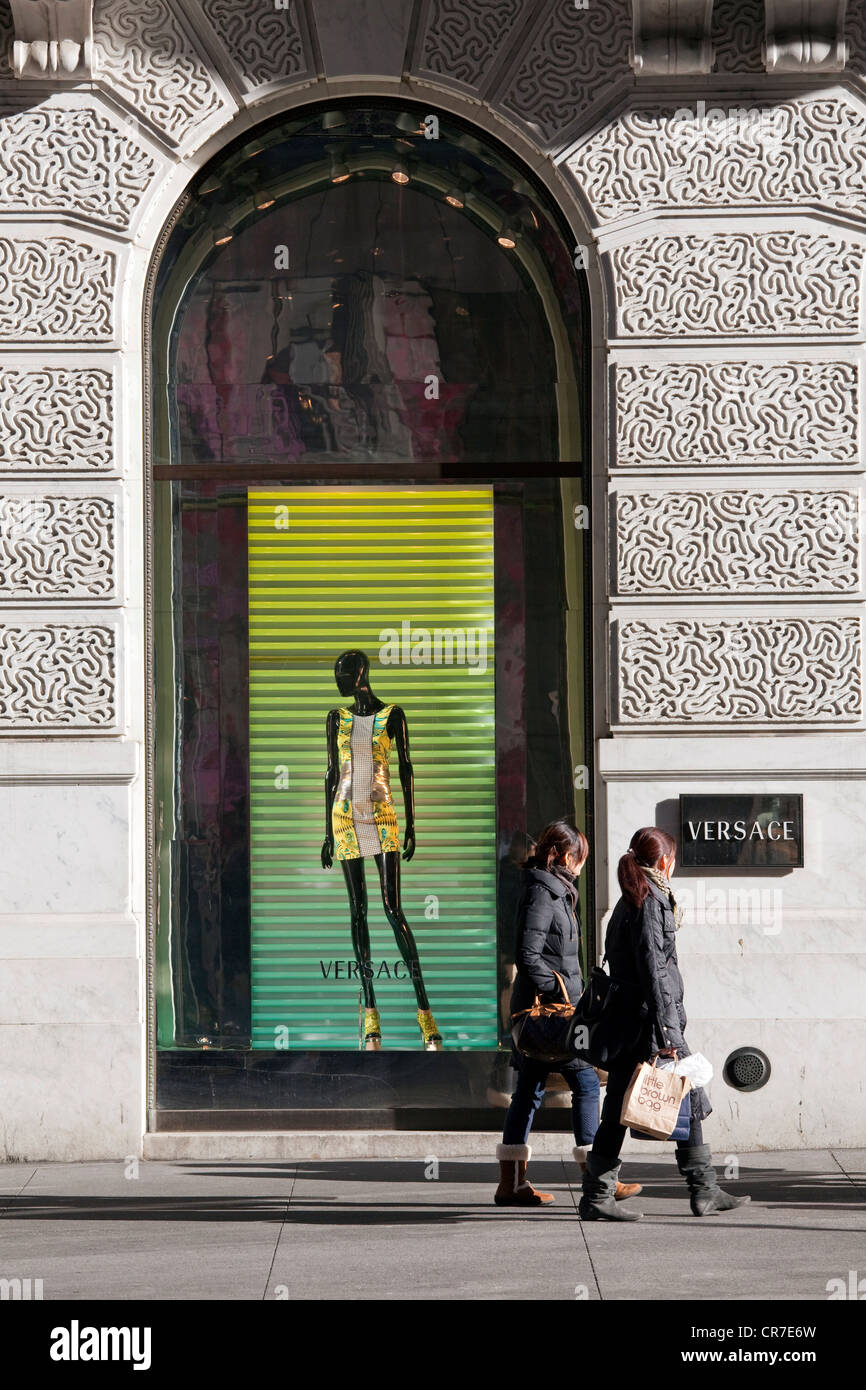 United States, New York City, Manhattan, 5th avenue, Versace boutique, window and pedestrians Stock Photo