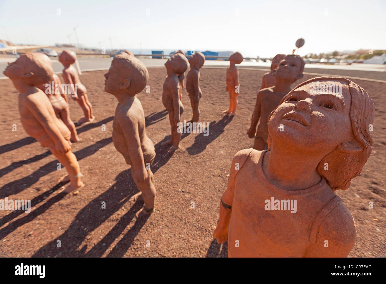 'Caminos', art work, 30 sculptures of children by Cuban sculptor Lisbet Fernandez, Morro Jable roundabout, Fuerteventura Stock Photo