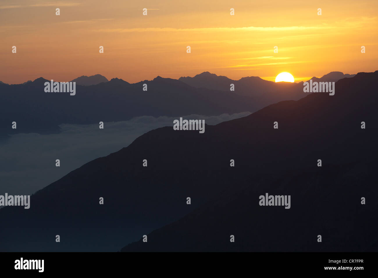 Sunrise over the Venosta Valley, South Tyrol, Italy. The view from the Stelvio Pass with the Dolomites on the horizon Stock Photo