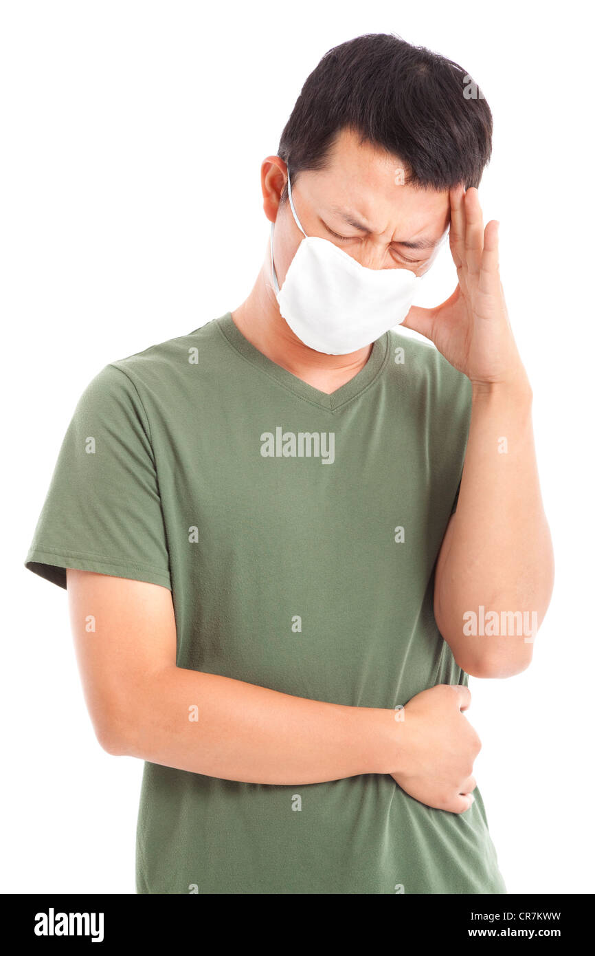 man wearing a face mask with headache Stock Photo Alamy