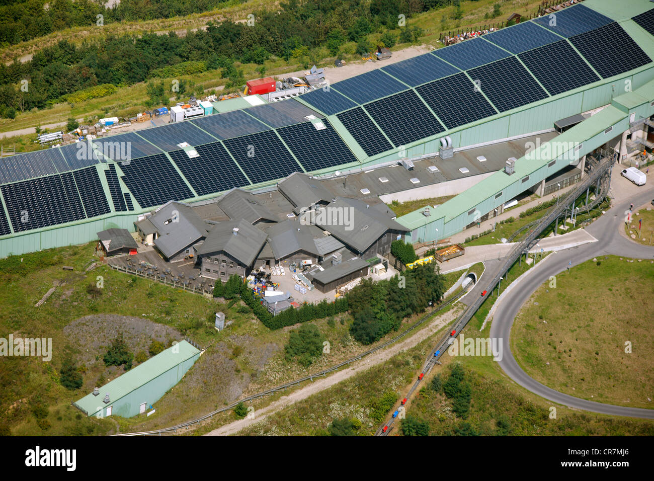 Aerial view, damage caused by sinking of the reclaimed land, Alpincenter Bottrop, with solar panels on the roofs, Bottrop Stock Photo