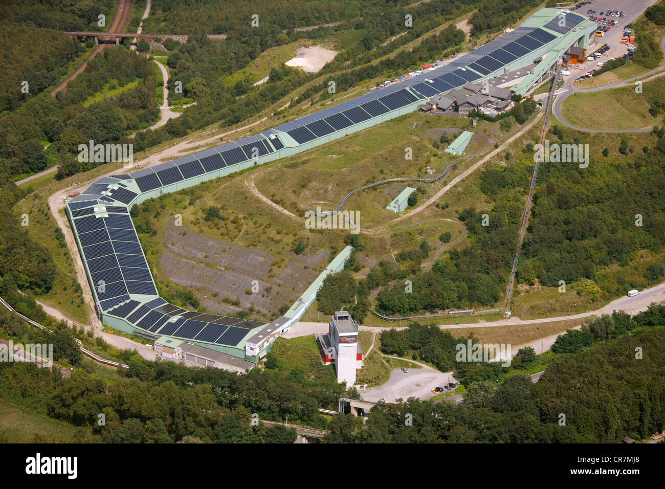 Aerial view, damage caused by sinking of the reclaimed land, Alpincenter Bottrop, with solar panels on the roofs, Bottrop Stock Photo