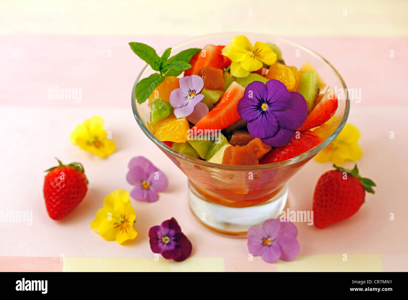 Fruit salad with quince and petals. Recipe available Stock Photo - Alamy
