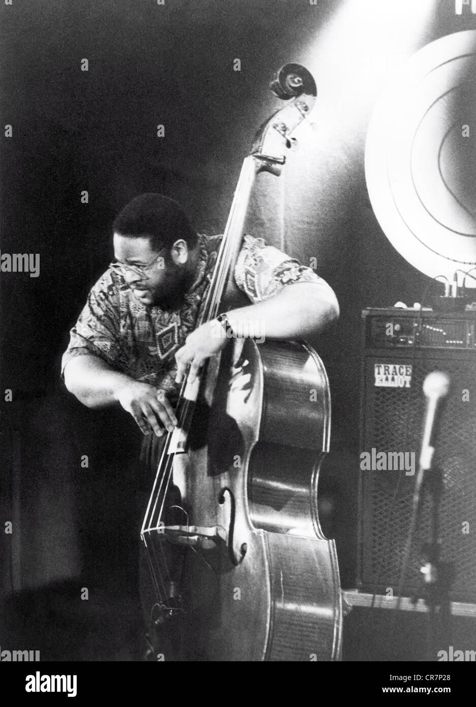 Dolphin, Dwayne, * 7.5.1963, American musician (jazz double bass player), half length, on stage, Jazz Festival, Montreux, 15.7.1992, 20th century, jazz musician, musical instrument, instrument, musical instruments, instruments, basses, contrabass, double bass, contrabasses, double bass player, bassist, make music, play music, making music, playing music, makes music, plays music, made music, played music, playing, play, standing, glasses, eyeglasses, picking, pick, pluck, plucking, amplifier, microphone, microphones, , Stock Photo