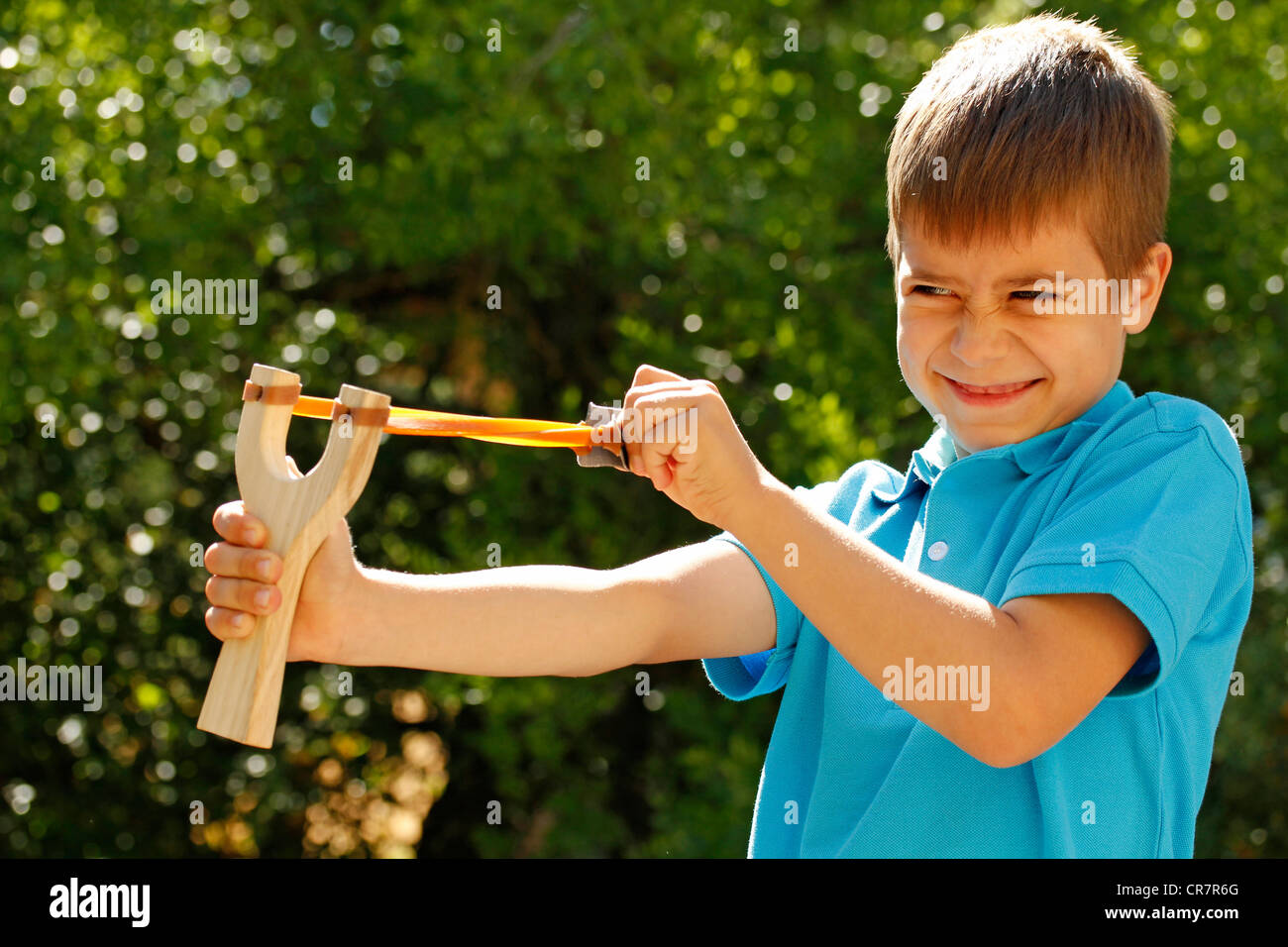 Boy and slingshot Stock Photo Alamy