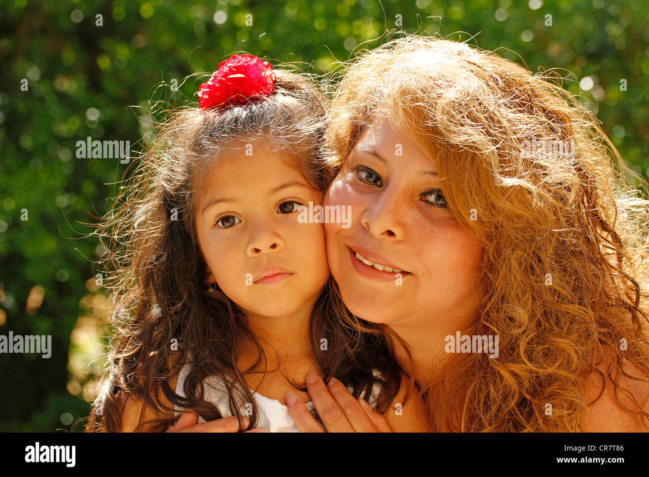 Hispanic little girl and her mother Stock Photo