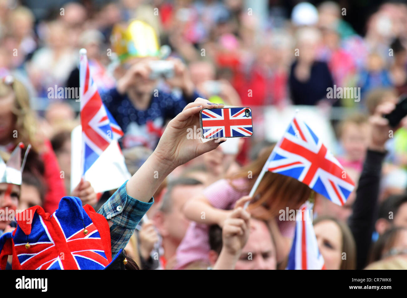 Crowd in George Street watching her Majesty the Queen visiting Corby, Northamptonshire , 13th June, 2012 Stock Photo