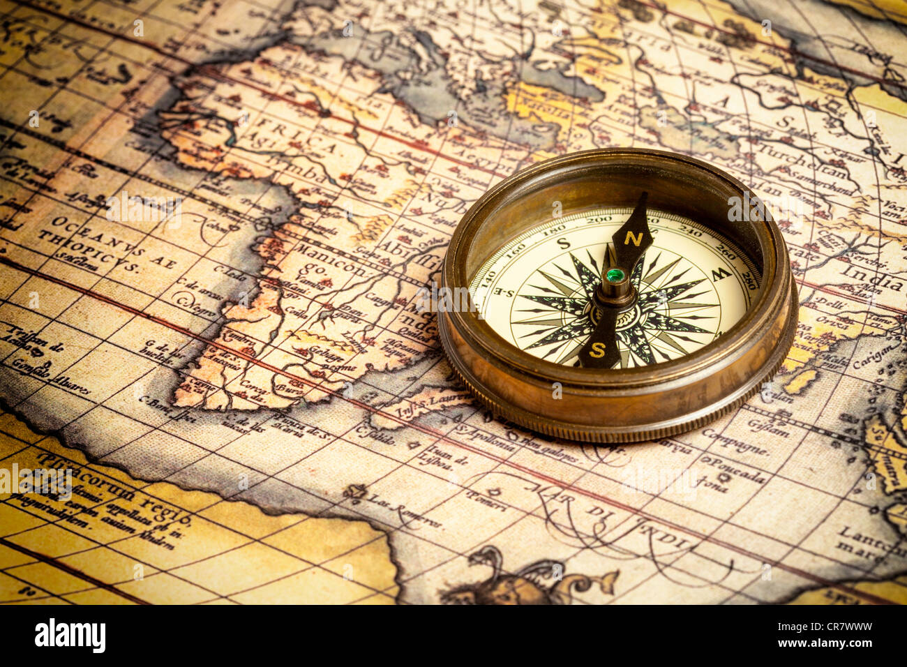 Old vintage retro compass on ancient map Stock Photo