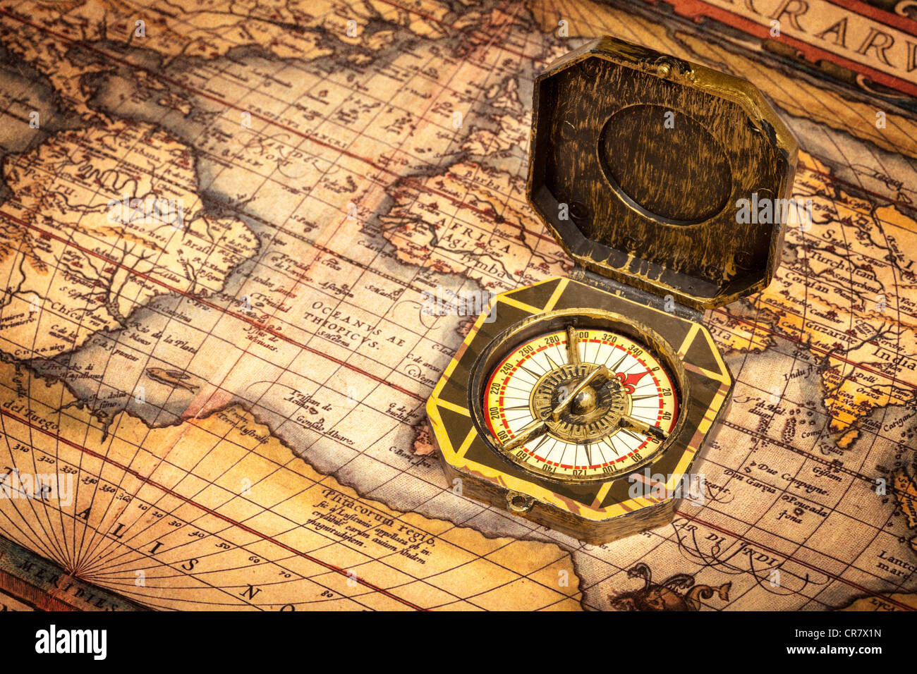 Vintage pirate retro compass on ancient world map Stock Photo