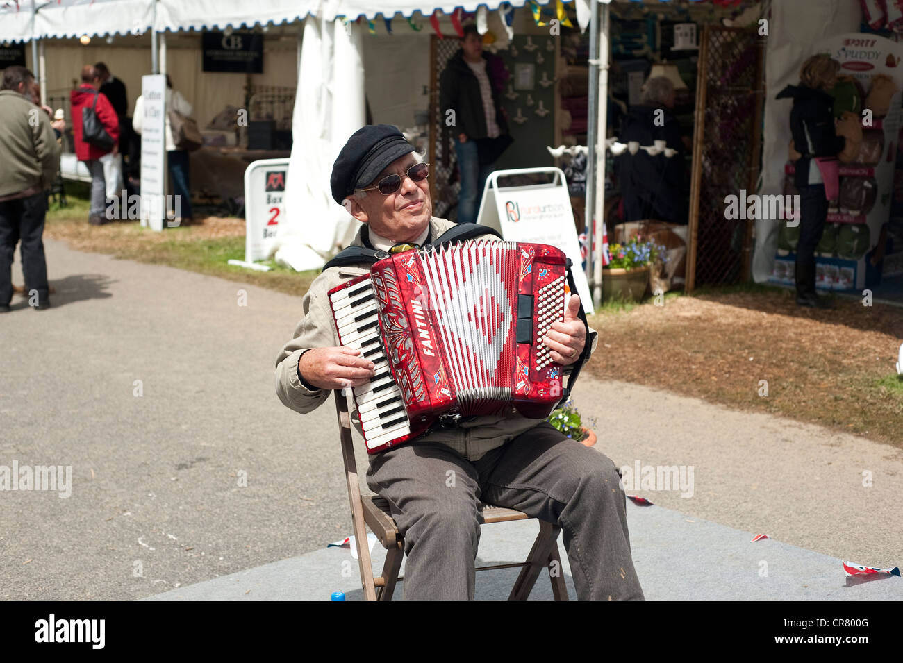 Cornwall, England, UK - An old man playing accordion. Stock Photo