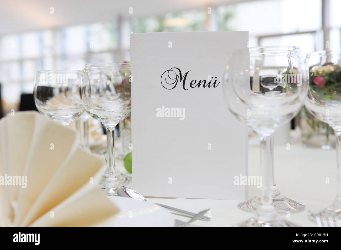 Banquet, dinner table, table decorated for a celebration with a menu card Stock Photo