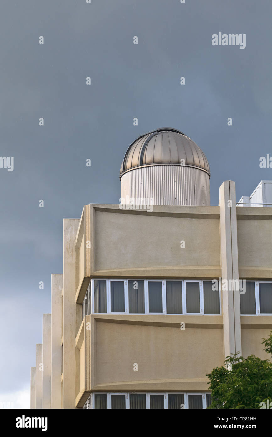 Observatory atop varsity building under an afternoon stormy sky. Stock Photo