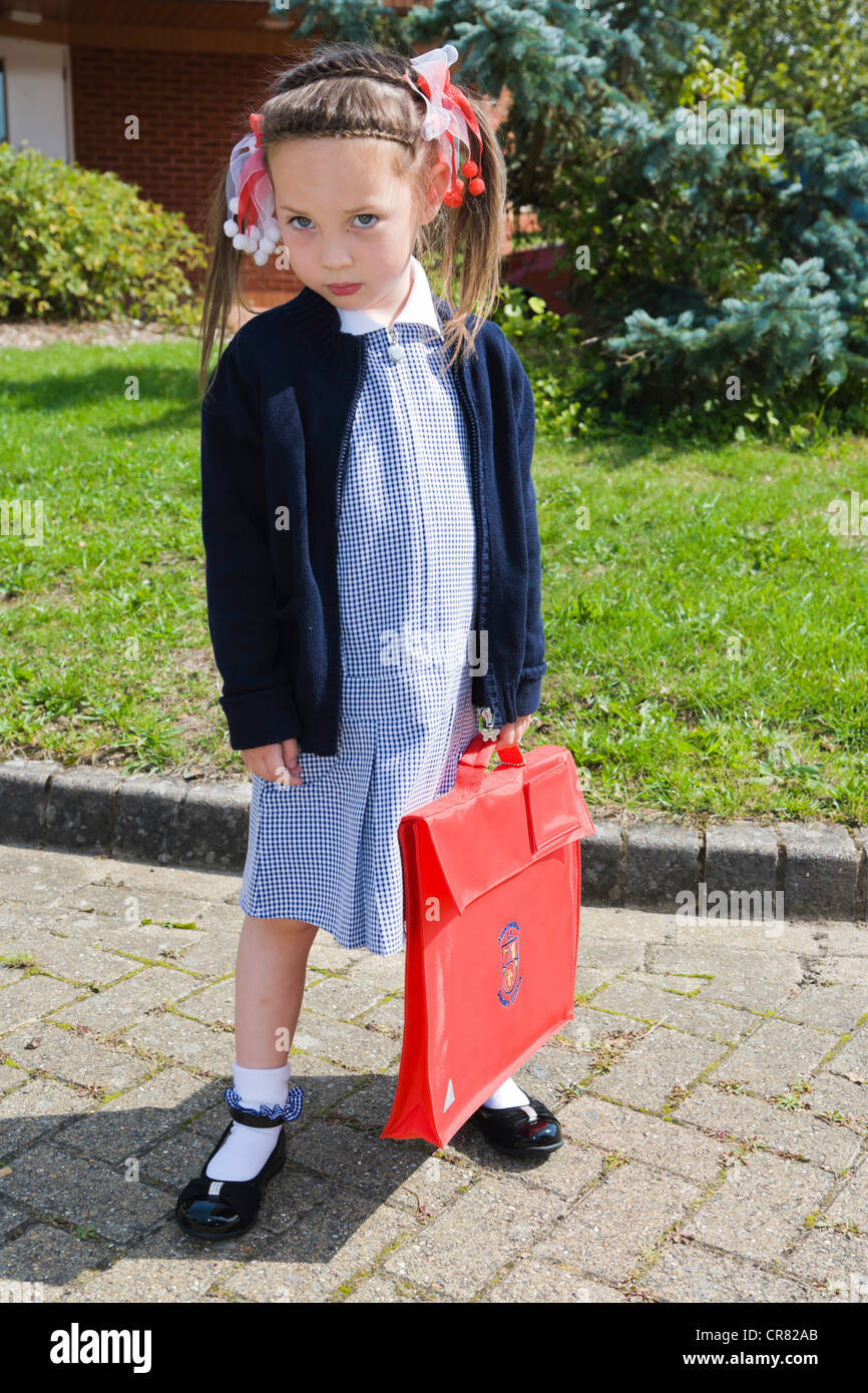 Schoolgirl, 4 years, in Gingham dress, summer school uniform, England, United Kingdom, Europe Stock Photo