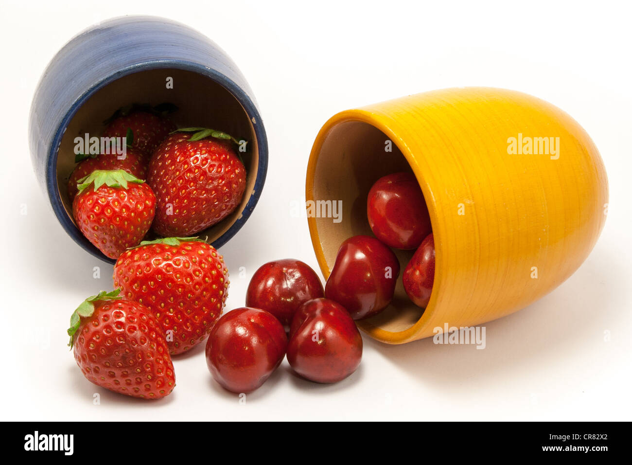 Cascade of ruby red strawberries and cherries Stock Photo - Alamy