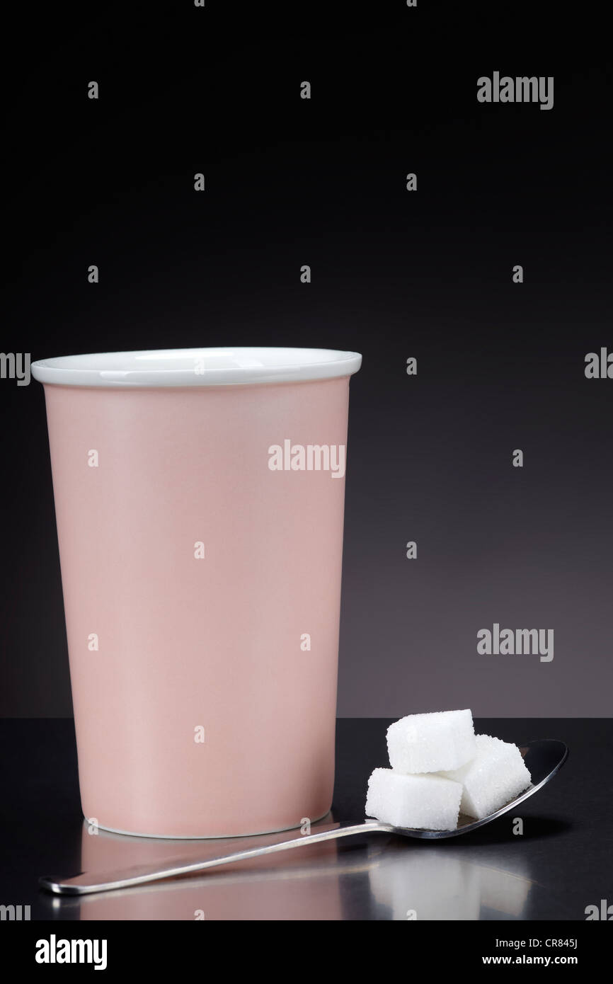 Pink coffee cup and teaspoon with sugar cubes Stock Photo Alamy