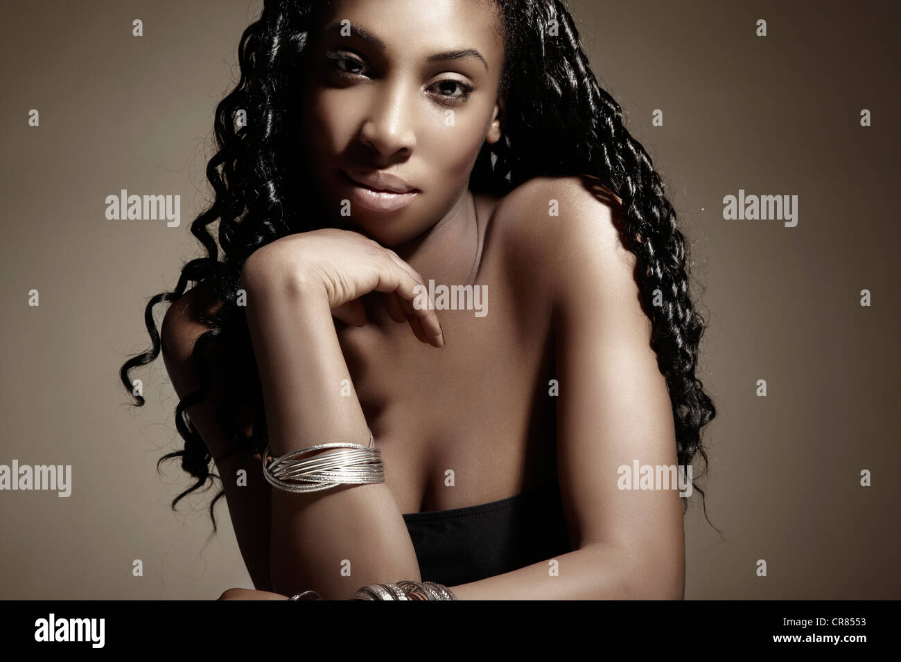 Portrait Of A Young Dark Skinned Woman Wearing Silver Jewellery