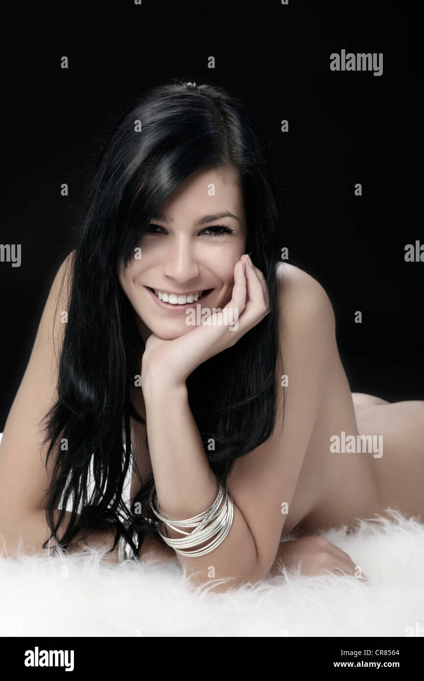 Naked Young Woman Lying On White Fur Beauty Shot Stock Photo Alamy