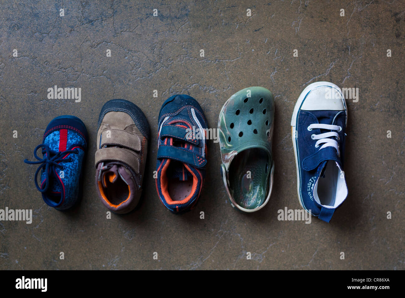 Children's shoes in various sizes from baby to kindergarten-age Stock Photo