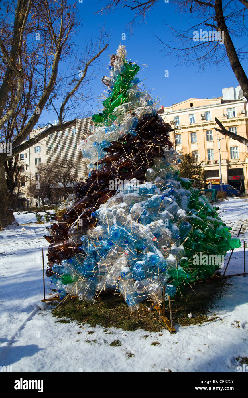 Trees in the snow made into Christmas decorations with recycled water bottles Stock Photo