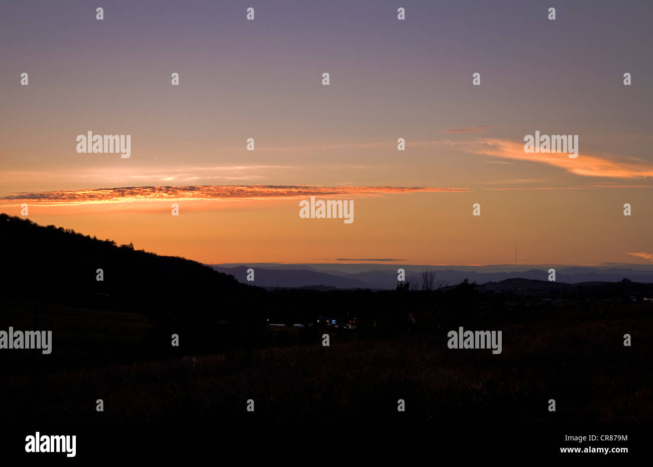 Sunset over the Rogue Valley in southern Oregon.  Taken looking north from Ashland to Medford. Stock Photo
