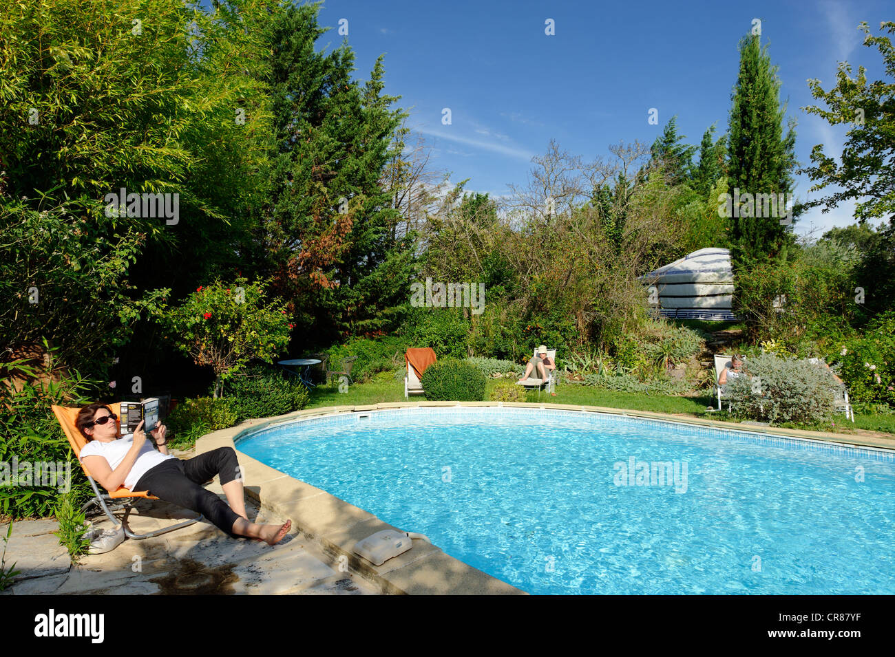 France, Gard, Barjac, Mas Escombelle, relaxing around the private pool
