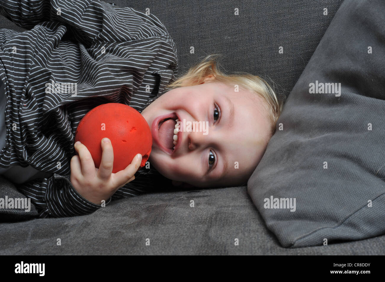 Boy with red ball Stock Photo