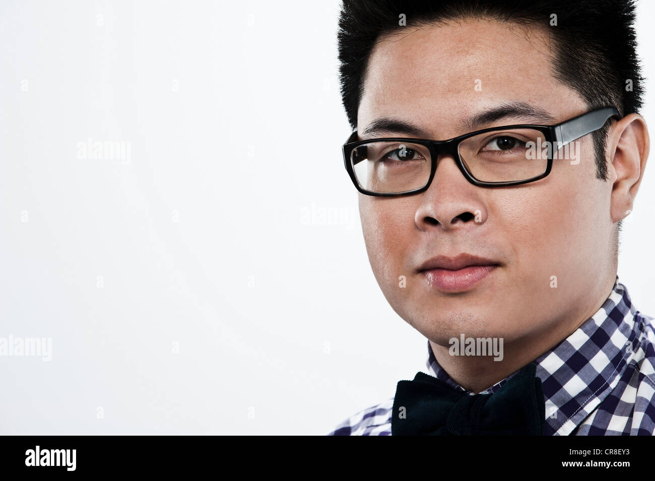 Portrait of young man against white background Stock Photo - Alamy