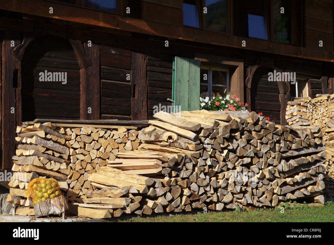 Beechwood firewood piled up outside an old farmhouse in Muenstertal in the Black Forest, Baden-Wuerttemberg, Germany, Europe Stock Photo