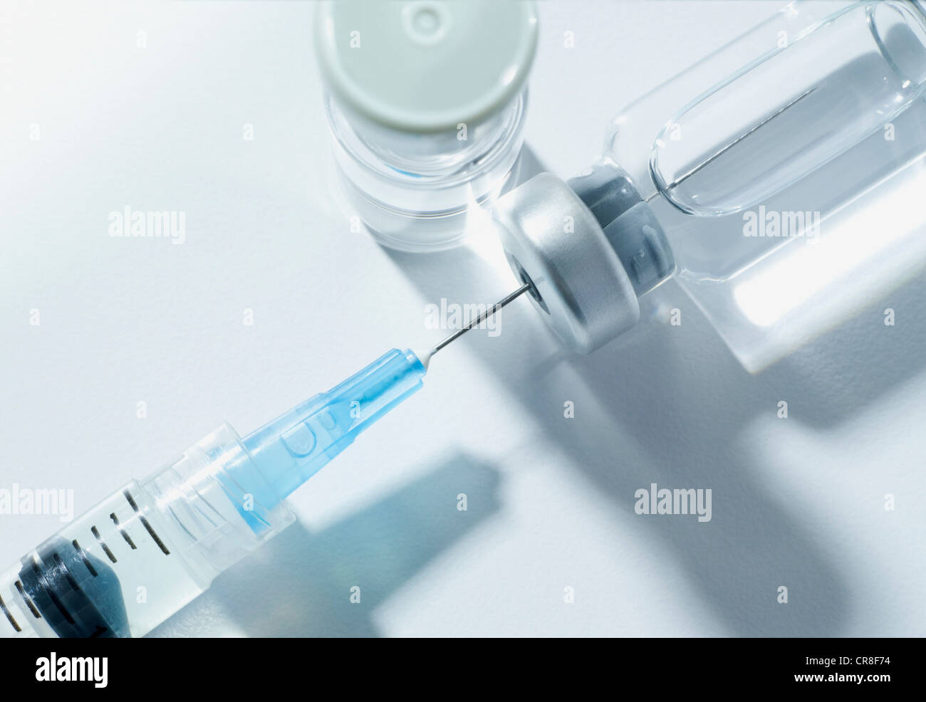 Syringe and vials, studio shot Stock Photo