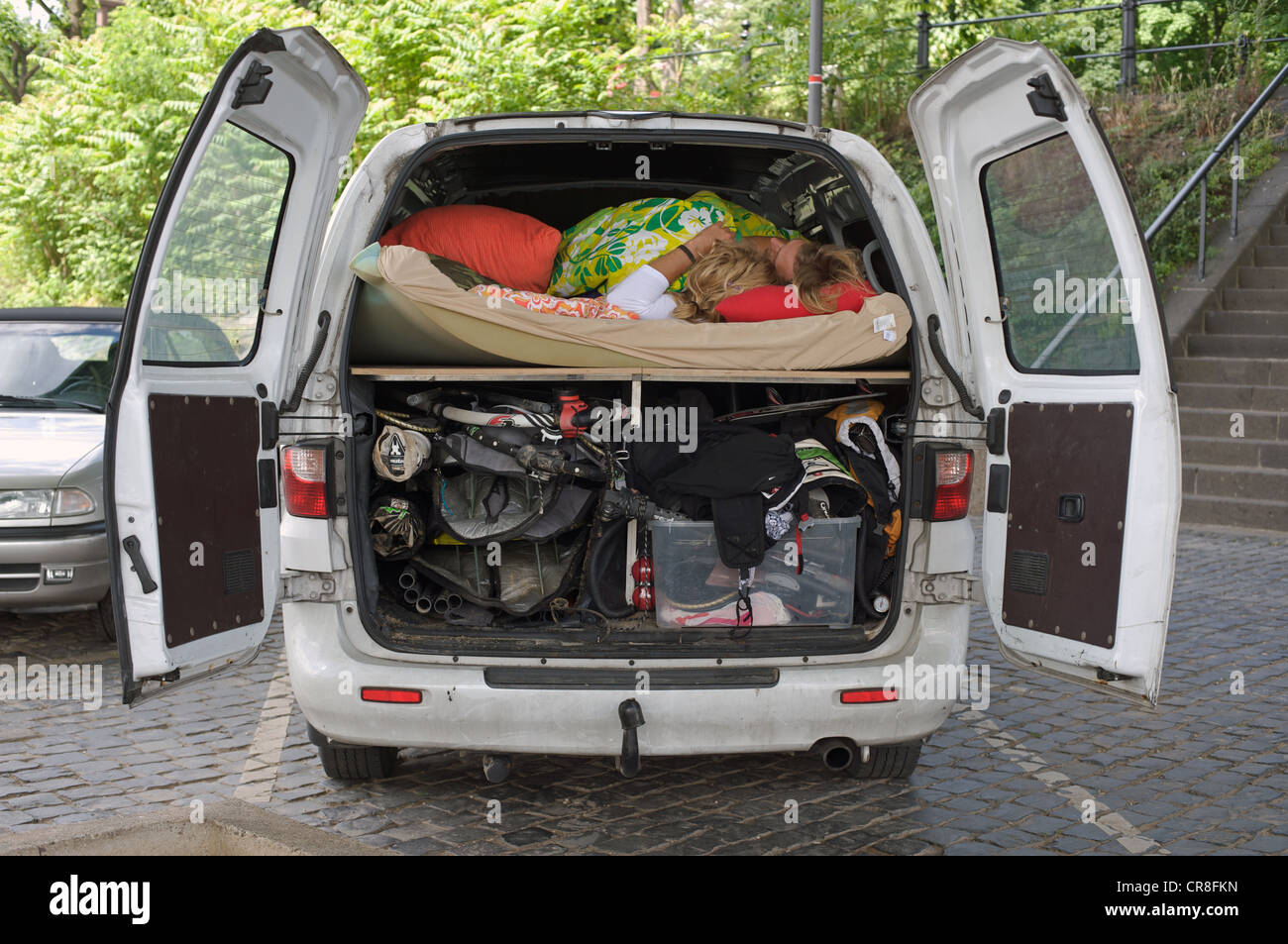 Young couple sleeping in converted van Stock Photo Alamy