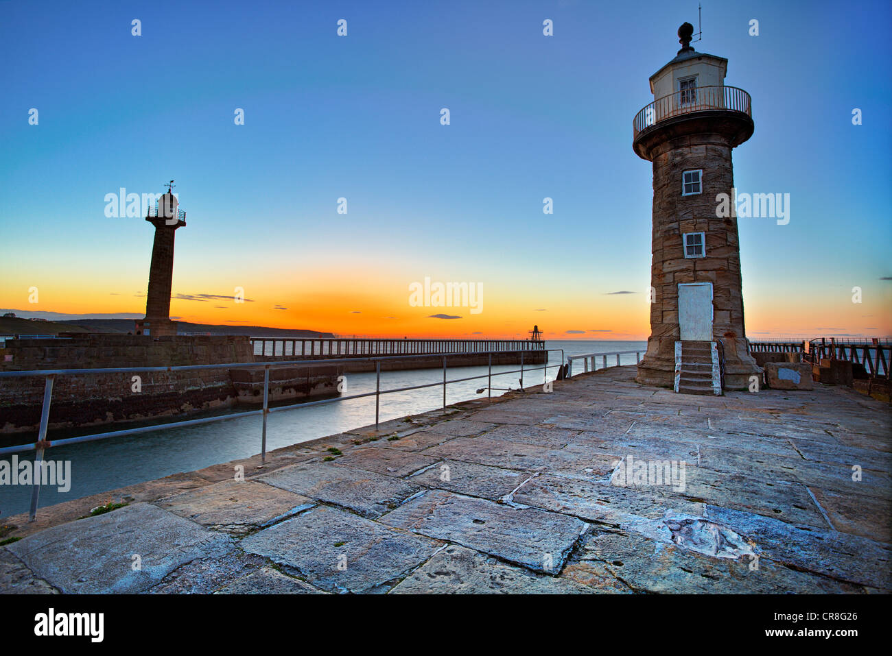 Whitby West Pier and East Pier lighthouse's viewed from the East Pier, North Yorkshire Stock Photo