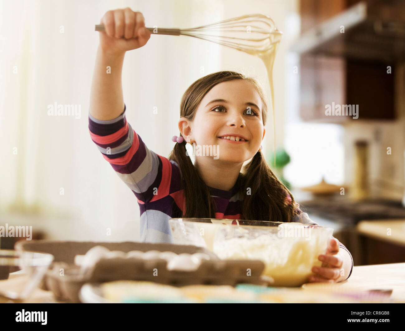 Girl mixing cake batter in bowl Stock Photo Alamy