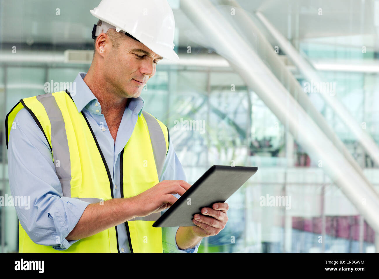 Engineer using digital tablet in office Stock Photo