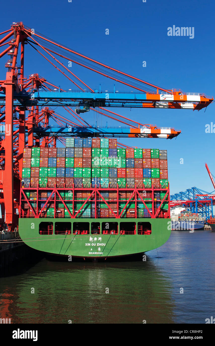 Container ships, loading containers on to the ship Xin Ou Zhou from Shanghai, China, Eurokai or Eurogate container terminal, and Stock Photo