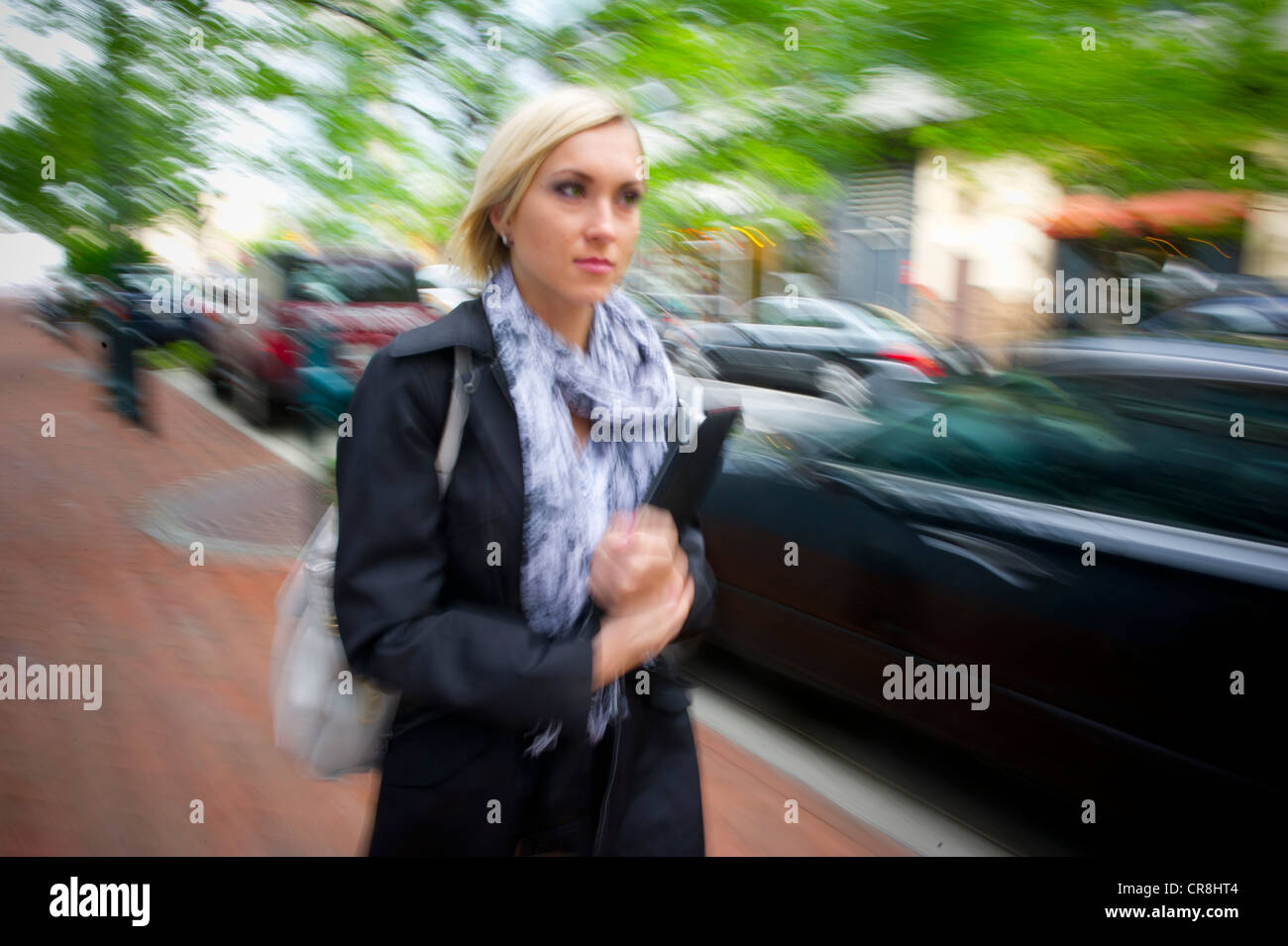 Woman walking on suburban sidewalk, Rockville Maryland Stock Photo