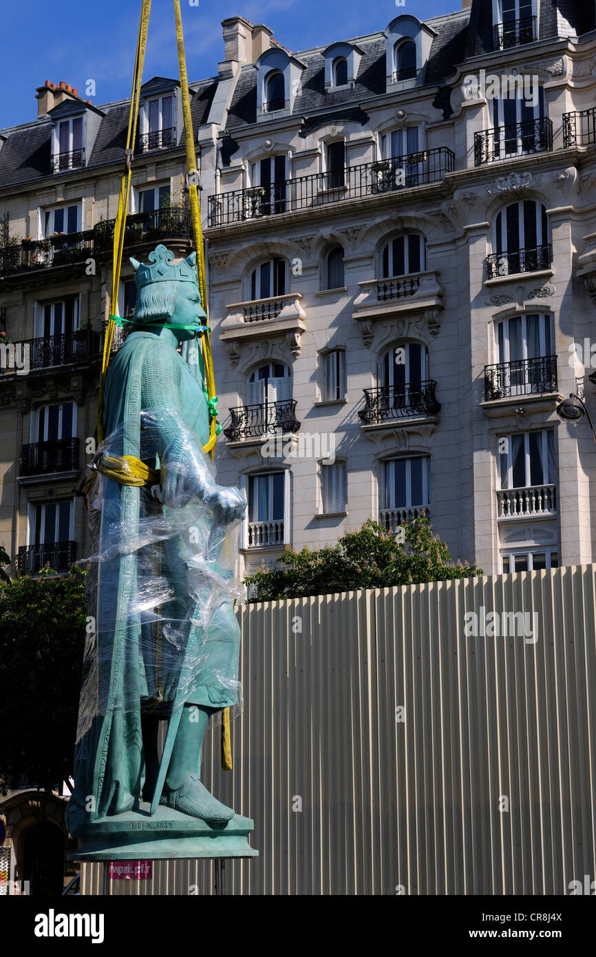 France, Paris, Place de la Nation, relocation of the statue Saint Louis on one of the two columns of the barrier of the throne Stock Photo