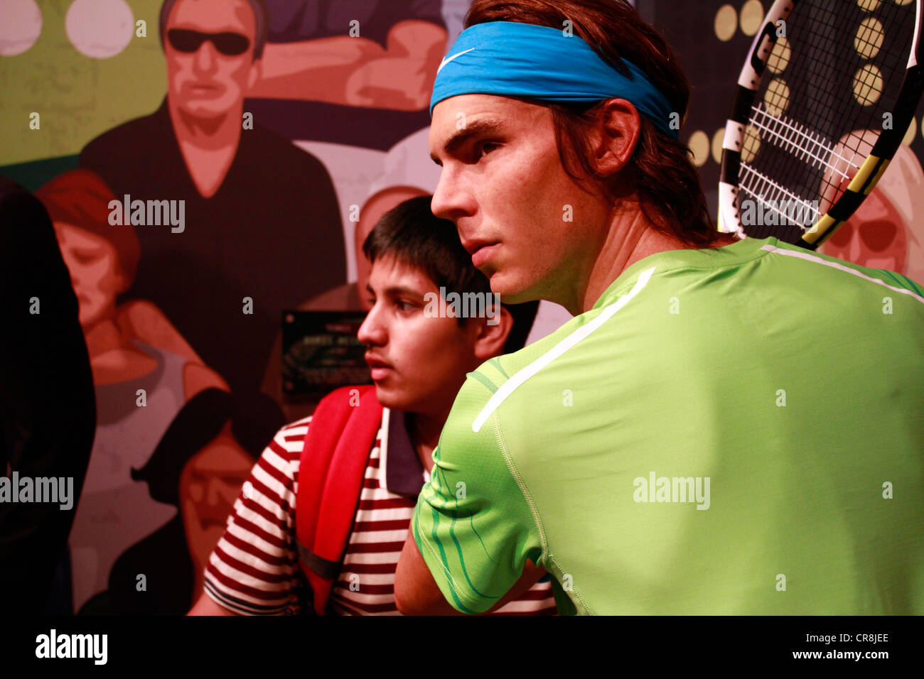 Boy posing next to the wax statue of Rafael Nadal at the madame tussauds museum Stock Photo